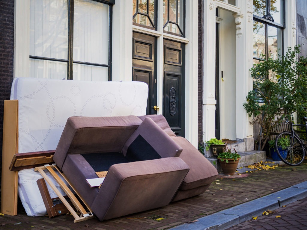 Used furnitures in front of a house