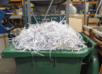 Shredded paper in a trashcan